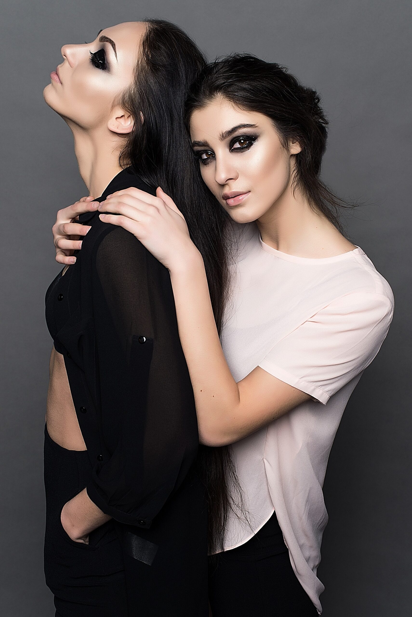 woman-in-white-crew-neck-t-shirt-embracing-woman-in-black-160599-scaled.jpg